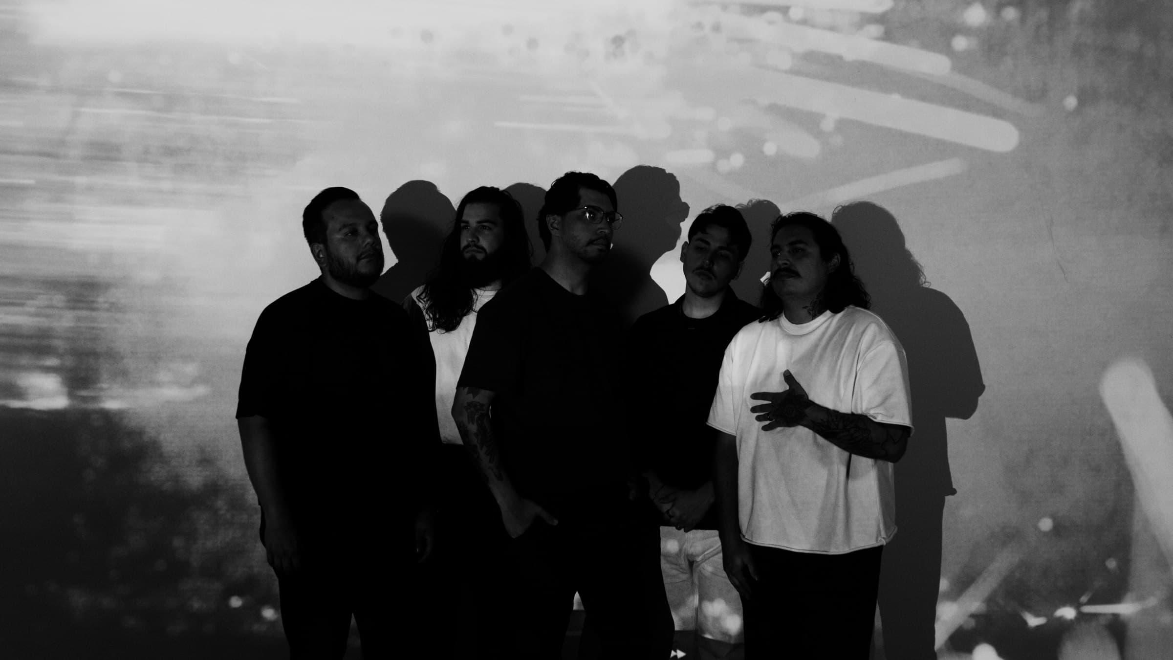 Bloodlines — the five members against a projected backdrop